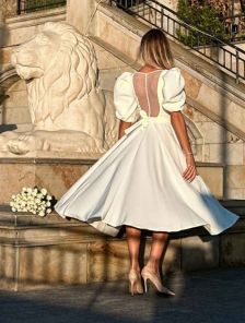Elegant milky midi dress with a chic back and puffy sleeves